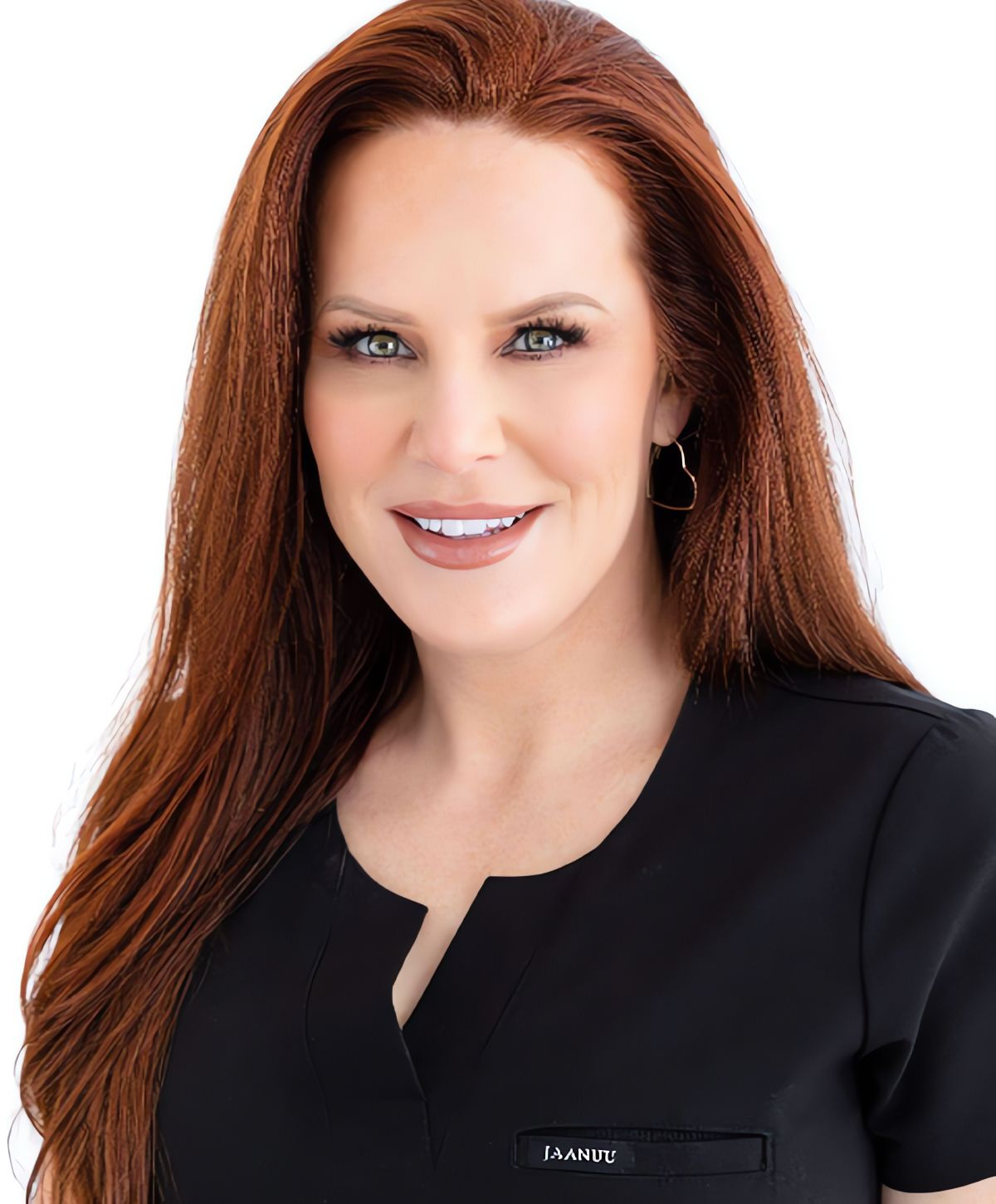 Professional woman with long red hair smiling.