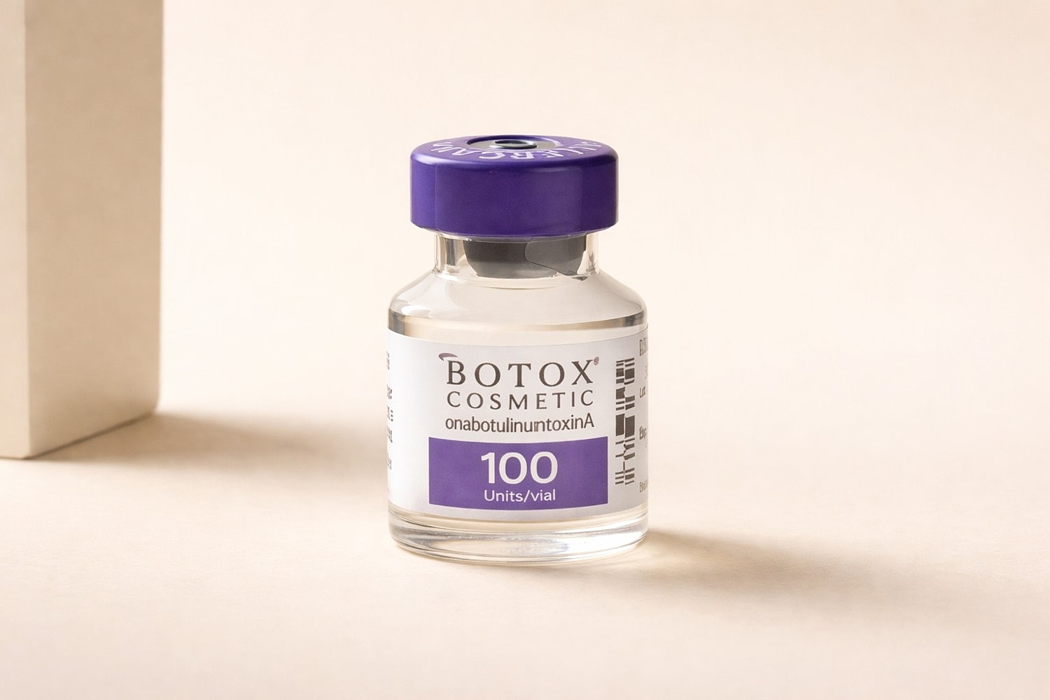 Smiling woman with stylish hair, soft expression.