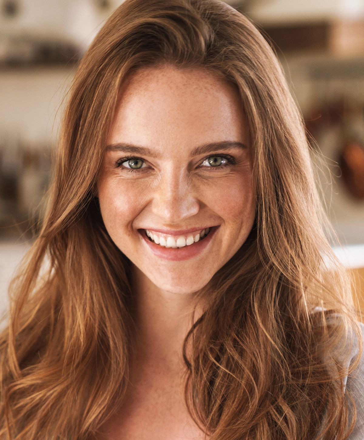 Woman with long hair looking back over shoulder.