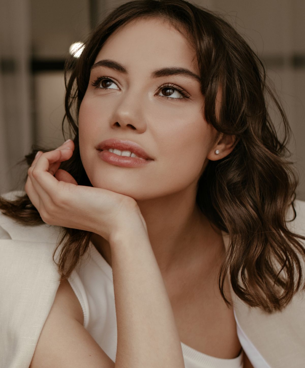 Portrait of a woman with thoughtful expression.