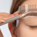 Woman undergoing brow shaping