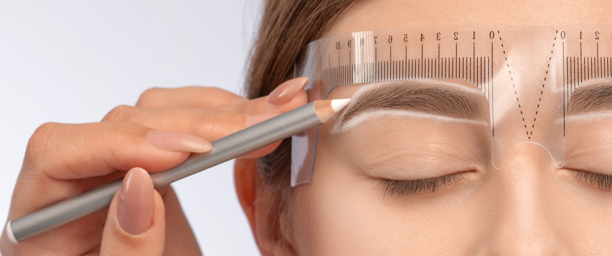 Woman undergoing brow shaping